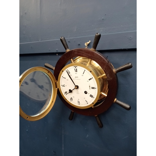 539 - Schulz compensated barometer and matching clock in ships wheel surround {D 10cm x Dia 33cm }.