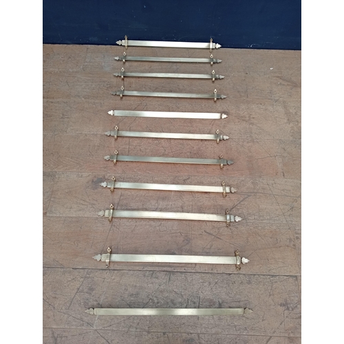 542 - Set of eleven Victorian brass stair rods  {H 3cm x W 56cm x D 3cm }.