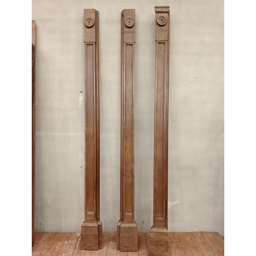 544 - Set of three wooden pillars with circular detail. {H 263cm x W 23cm x D 10cm }.