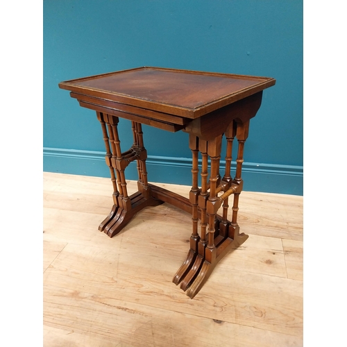 557 - Good quality Edwardian mahogany nest of three table raised on turned columns and platform feet {56 c... 