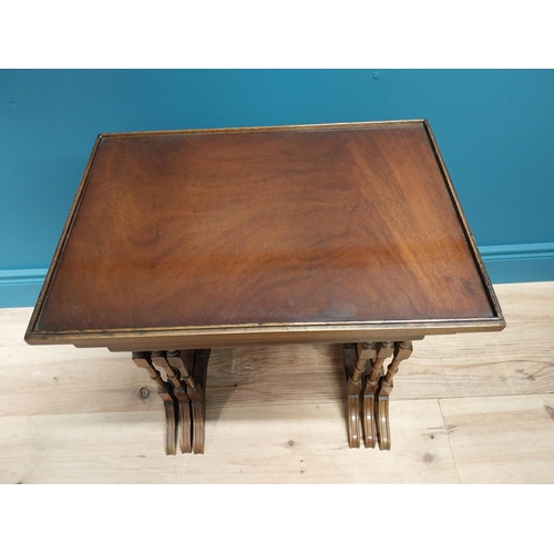 557 - Good quality Edwardian mahogany nest of three table raised on turned columns and platform feet {56 c... 