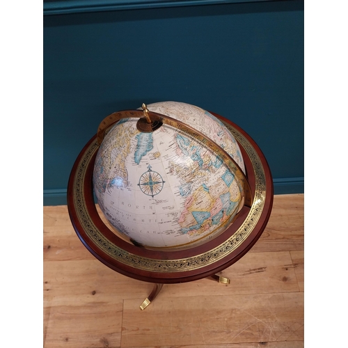 567 - Good quality mahogany and gilded brass world globe raised on turned column and three outswept feet {... 