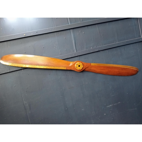 579 - Teak and brass propeller  {W 180cm x W 16cm x D 6cm }.