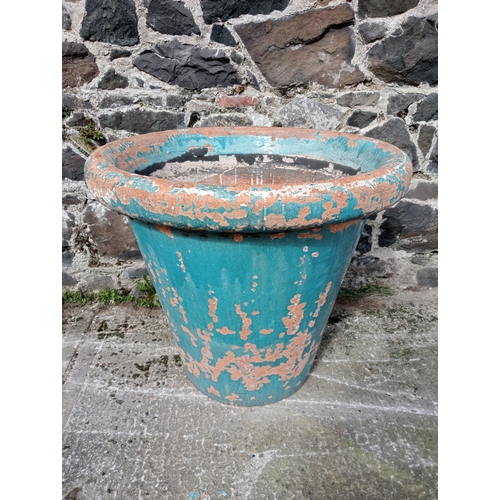 581 - Terracotta glazed planter with damage {H 68cm x Dia 80cm}.