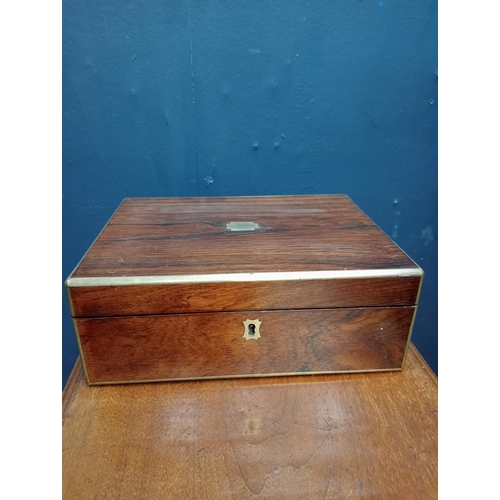 597 - Victorian brass bound rosewood writing slope. {H 11cm x W 30cm x D 22cm }.