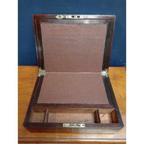 597 - Victorian brass bound rosewood writing slope. {H 11cm x W 30cm x D 22cm }.