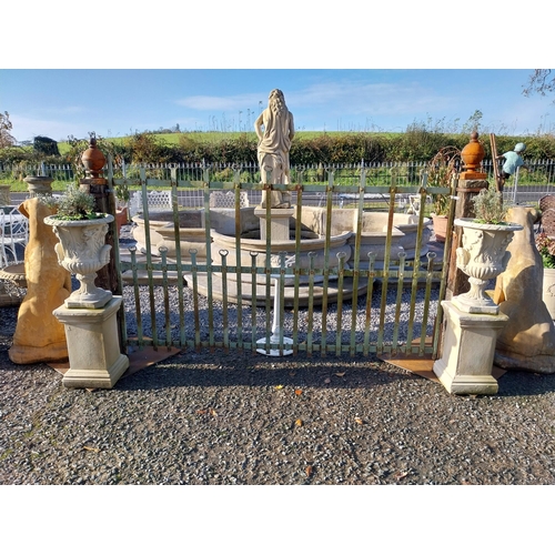 600 - Pair of moulded stone Grecian urns on square bases. {110 cm H x 39 cm W x 39 cm D}.