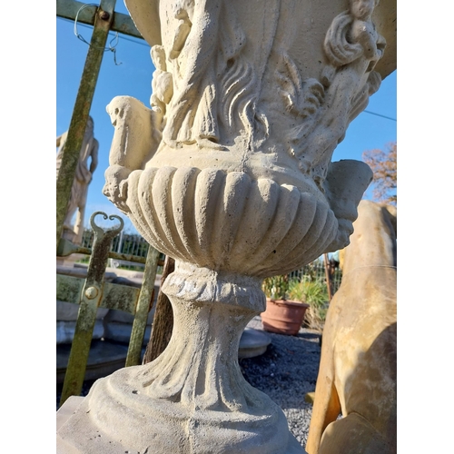 600 - Pair of moulded stone Grecian urns on square bases. {110 cm H x 39 cm W x 39 cm D}.