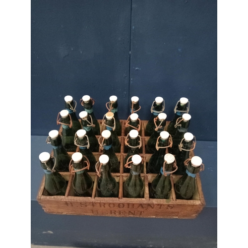 633 - Wooden crate with twenty four beer bottles swing top