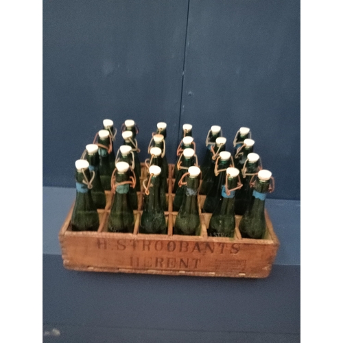 633 - Wooden crate with twenty four beer bottles swing top