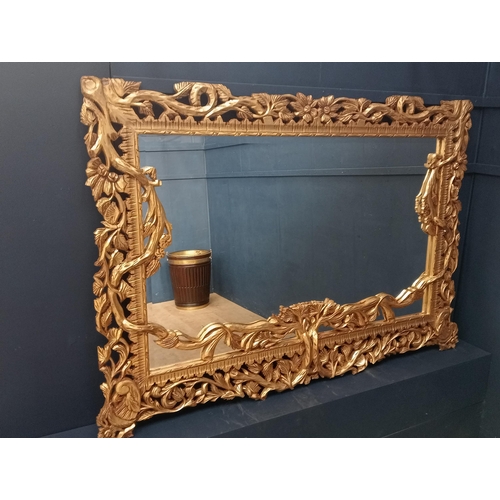 638 - Wooden gilt rectangle mirror surmounted with branches and leaves {H 140cm x W 200cm x D 5cm }.