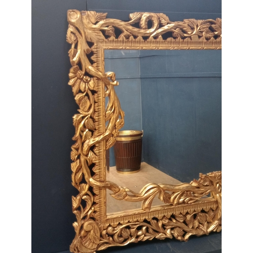 638 - Wooden gilt rectangle mirror surmounted with branches and leaves {H 140cm x W 200cm x D 5cm }.