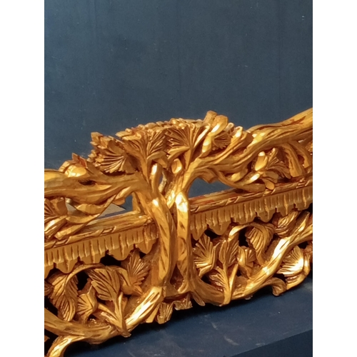 638 - Wooden gilt rectangle mirror surmounted with branches and leaves {H 140cm x W 200cm x D 5cm }.