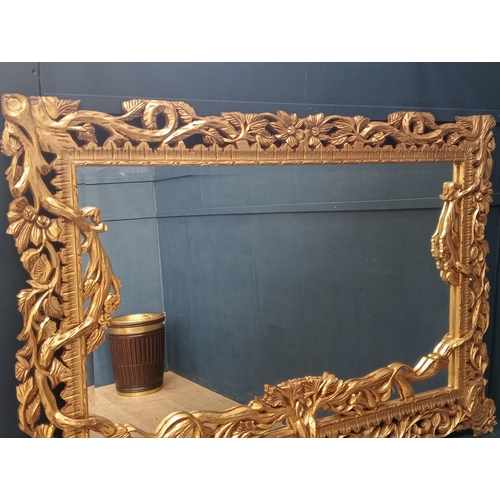 638 - Wooden gilt rectangle mirror surmounted with branches and leaves {H 140cm x W 200cm x D 5cm }.