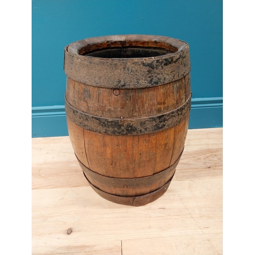 717 - Early 20th C. oak and metal bound log bucket {42 cm H x 34 cm Dia.}.