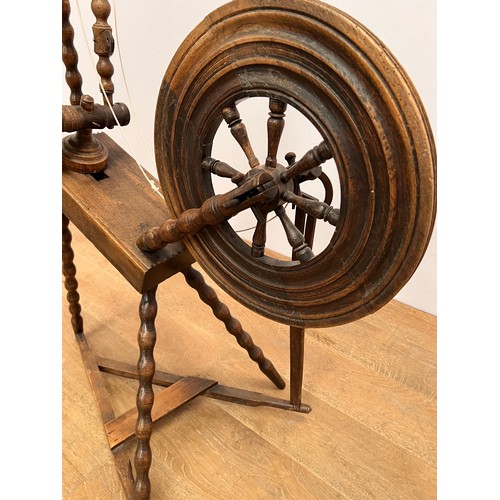 21 - 19th C. Oak spinning wheel . {H 115cm x W 58cm  x  L 68cm}.