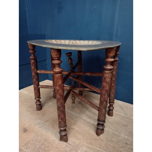 663 - Six legged wooden Indian style coffee table with copper tap depicting peacocks {H 50cm x W 58cm x D ... 