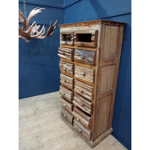 665 - Fourteen drawer driftwood chest {H 146cm x W 75cm x D 42cm}.