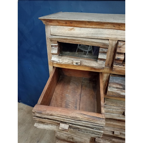 665 - Fourteen drawer driftwood chest {H 146cm x W 75cm x D 42cm}.