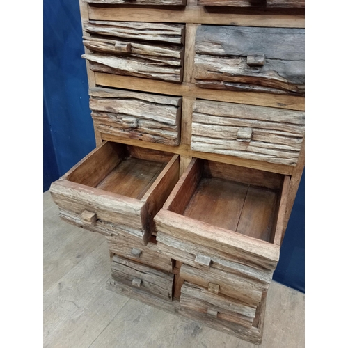 665 - Fourteen drawer driftwood chest {H 146cm x W 75cm x D 42cm}.