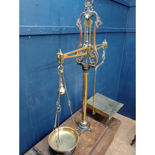 668 - 19th C. Cast and brass Grocer's scales {H 200cm x W 80cm x D 35cm}.