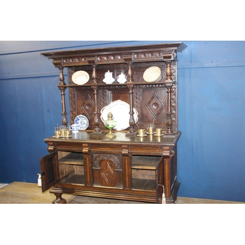 669 - 19th C. Oak carved two door dresser with inlaid doors and open shelves on turned columns supports. {... 