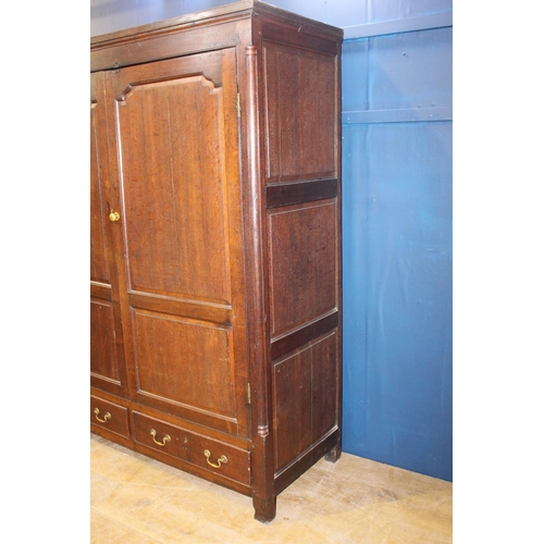 671 - 19th C. Oak linen press with two long doors over two short drawers with brass handles on square legs... 