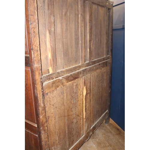 671 - 19th C. Oak linen press with two long doors over two short drawers with brass handles on square legs... 