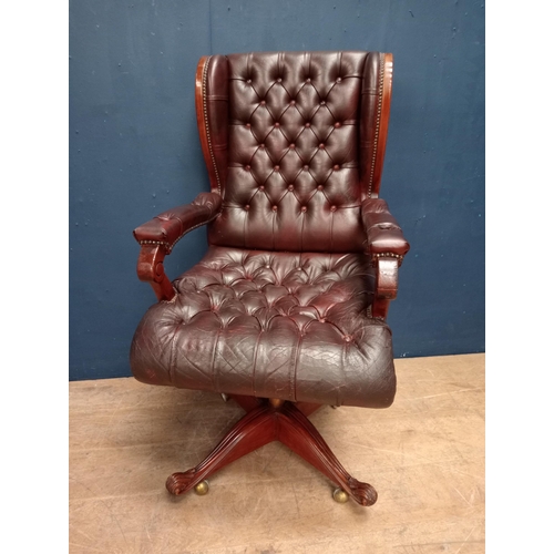 683 - Red leather deep button swivel office chair {H 113cm x W 63cm x D 65cm}.