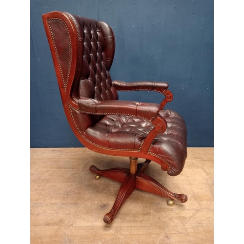 683 - Red leather deep button swivel office chair {H 113cm x W 63cm x D 65cm}.