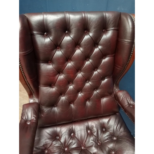 683 - Red leather deep button swivel office chair {H 113cm x W 63cm x D 65cm}.