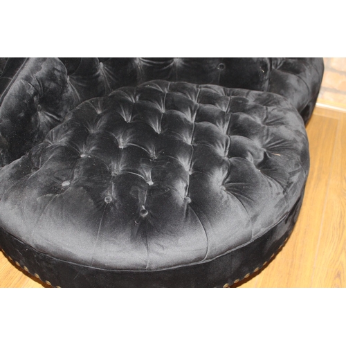 695 - Four seater deep button conversation seat on turned legs with black velvet upholstery {H 100cm x W14... 