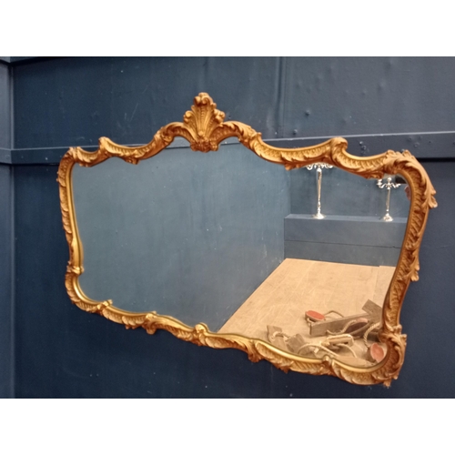 743 - Decorative gilt framed mirror in the Rococo manner {H 69cm x W 105cm x D 4cm}.