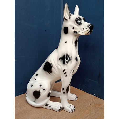 753 - Ceramic seated Dalmatian dog {H 74cm x W 50cm x D 30cm}.