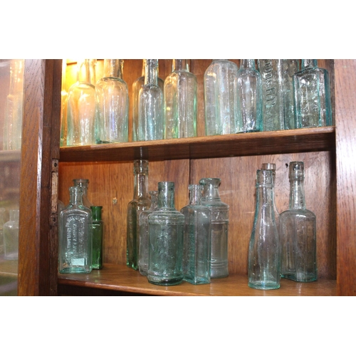 762 - 19th C. Collection of twenty  glass sauce bottles {Tallest H 19cm down to H 14cm}.