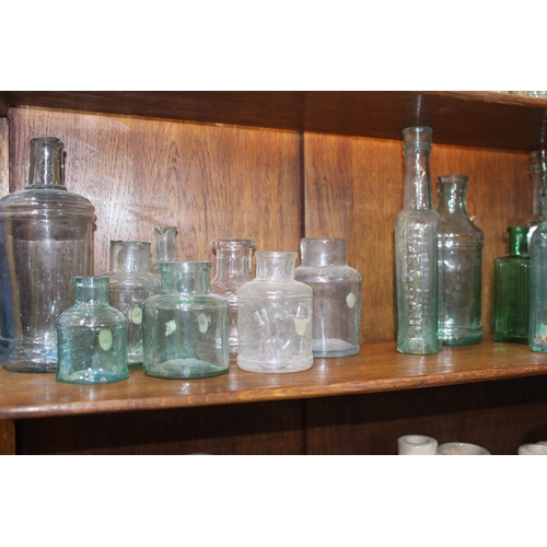 762 - 19th C. Collection of twenty  glass sauce bottles {Tallest H 19cm down to H 14cm}.