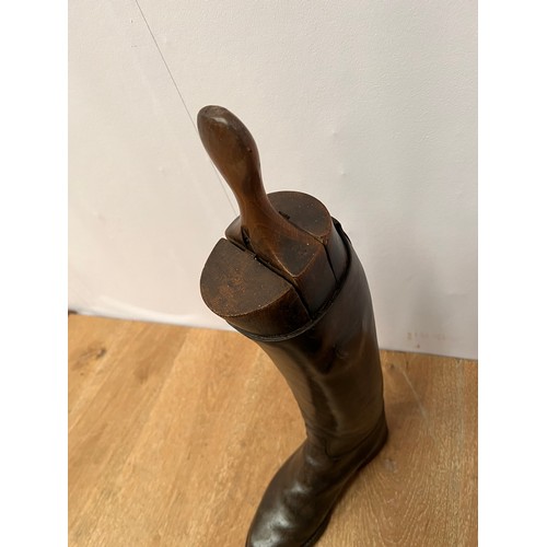 138 - Dark brown leather riding boots with wooden trees. {L 29cm l x H 62cm including stays }.