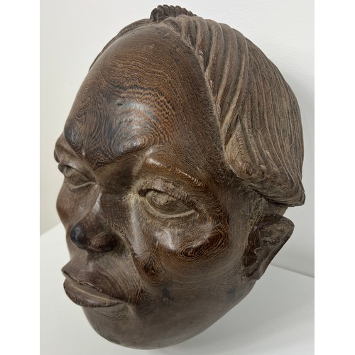 205 - Early 19th C. Hand carved ebony mask. {H 40cm x W 30cm x D 23cm }.