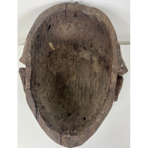 205 - Early 19th C. Hand carved ebony mask. {H 40cm x W 30cm x D 23cm }.