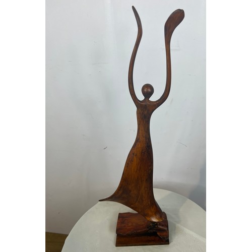 208 - Decorative carved wooden ballerina on base. {H 68cm x W 23cm x D 12cm}.