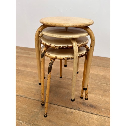 545 - Set of four Retro metal stacking stools  {H 42cm x Dia 29cm }.