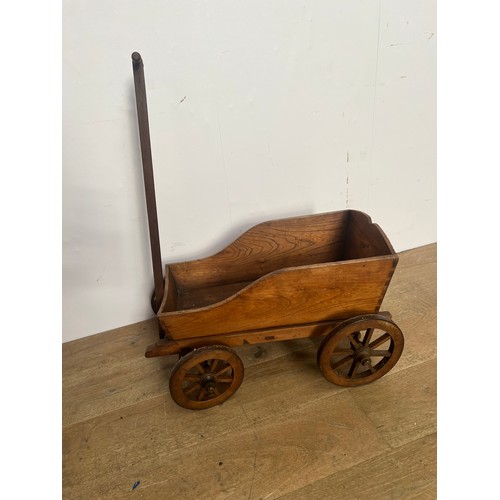 629 - Wooden four wheel toy cart {H 86cm x D 68cm x W 44cm }.