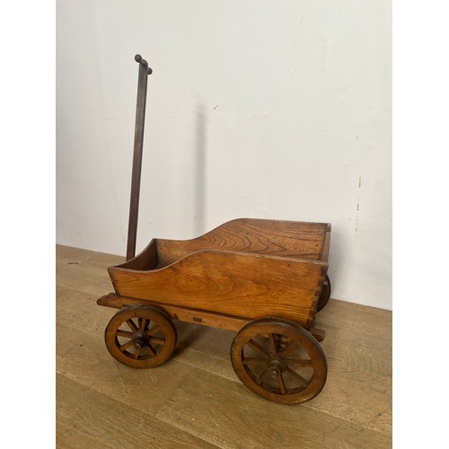 629 - Wooden four wheel toy cart {H 86cm x D 68cm x W 44cm }.