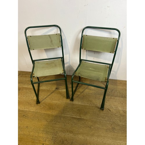 442 - Pair of retro green metal stacking chairs  {H 84cm x  w 44cm x d 43cm }.