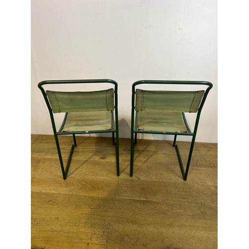 442 - Pair of retro green metal stacking chairs  {H 84cm x  w 44cm x d 43cm }.