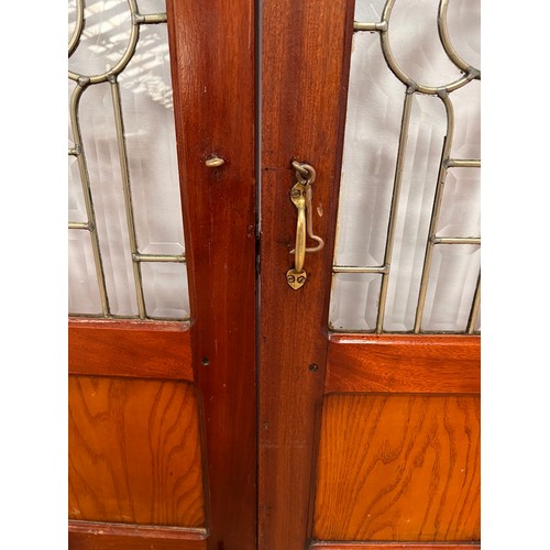 455 - Pair of mahogany saloon bar doors with brass handles and fixtures leaded bevelled glass  {one door- ... 