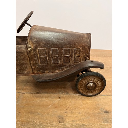 679 - 1940's tinplate children's pedal car { H 50cm x W40cm x L 95cm}.