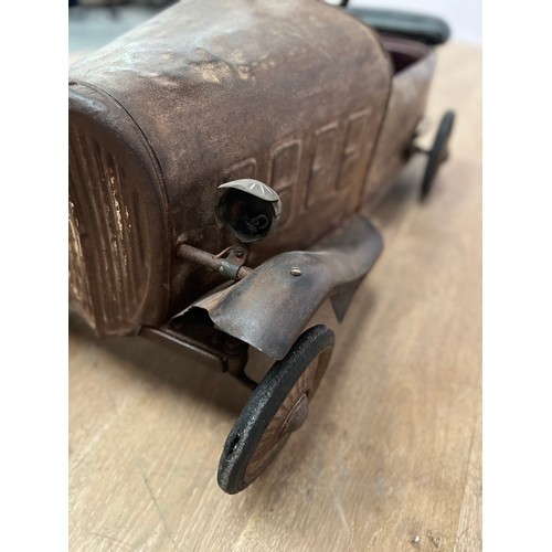 679 - 1940's tinplate children's pedal car { H 50cm x W40cm x L 95cm}.