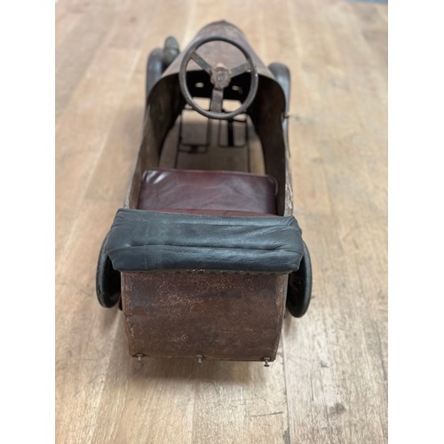 679 - 1940's tinplate children's pedal car { H 50cm x W40cm x L 95cm}.