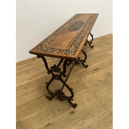 746 - 20th C. Cast iron scroll base teak wood table with three scrolled legs and single stretcher {H 75cm ... 